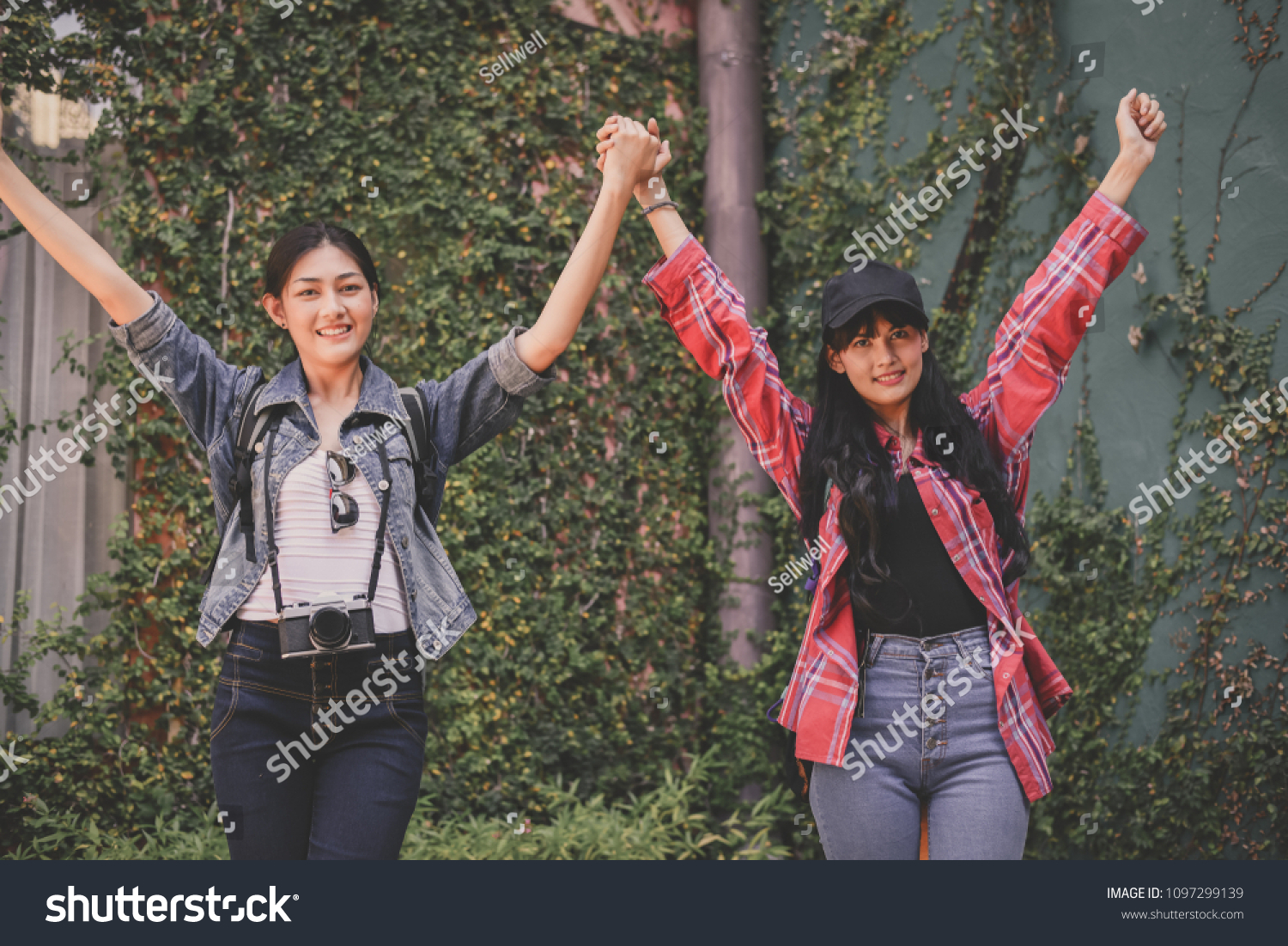 Travel and relaxing Concepts Tourists are taking photos in the city. Asian girls are happily traveling. Beautiful girl is relaxing Travel. Asian girls are traveling in Asia.