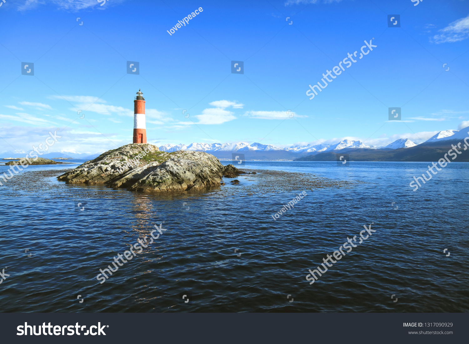Red and white striped Les Eclaireurs lighthouse on a rocky islands of Beagle channel  Ushuaia  Tierra del Fuego  Patagonia  Argentina