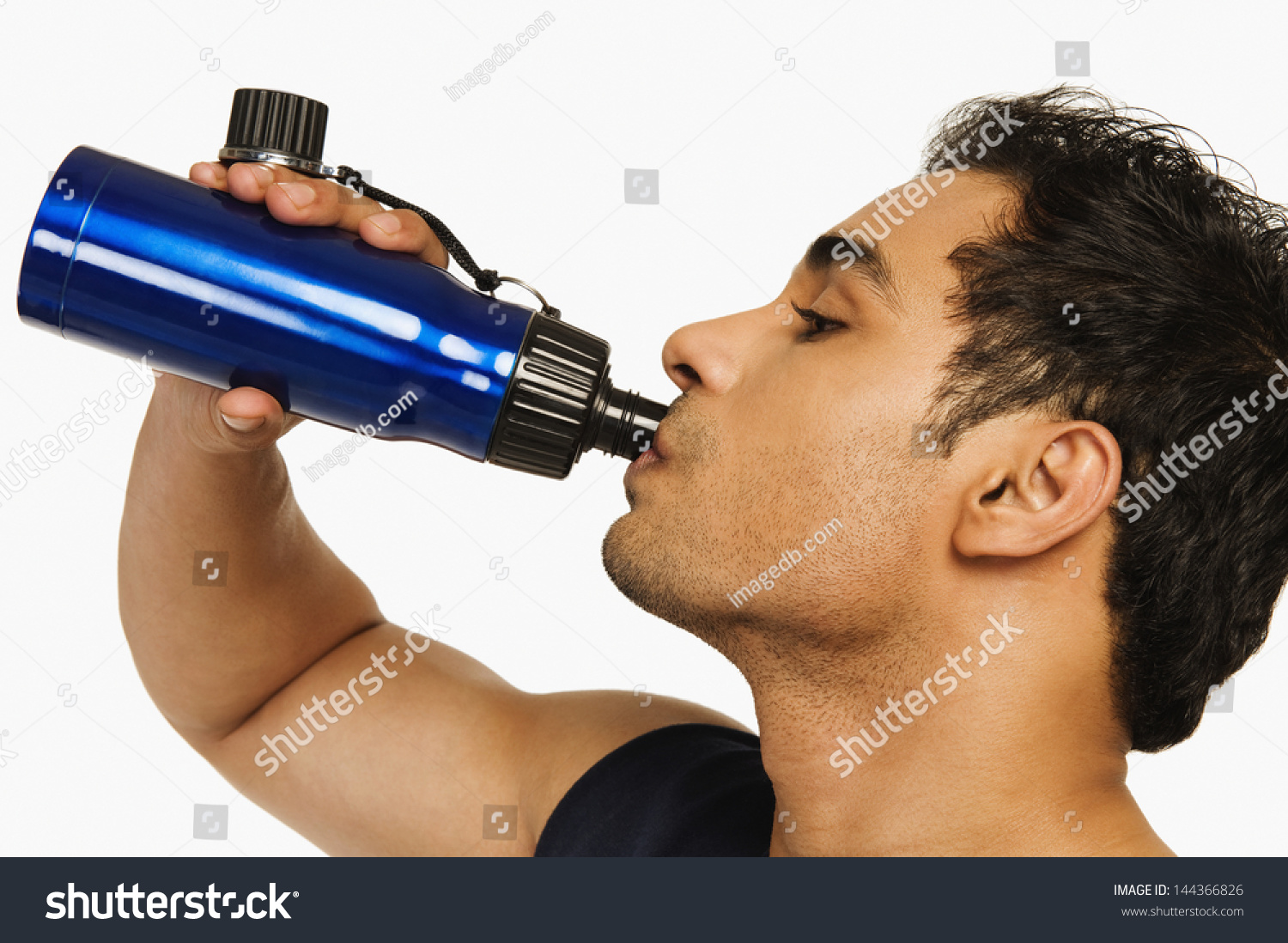 Man drinking water from a bottle