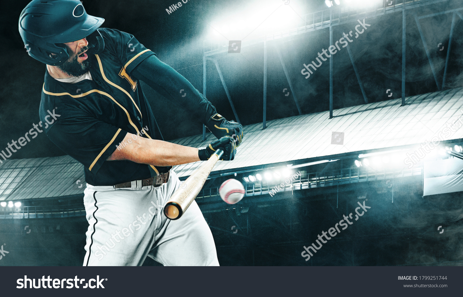 Porfessional baseball player with bat taking a swing on grand arena. Ballplayer on stadium in action.