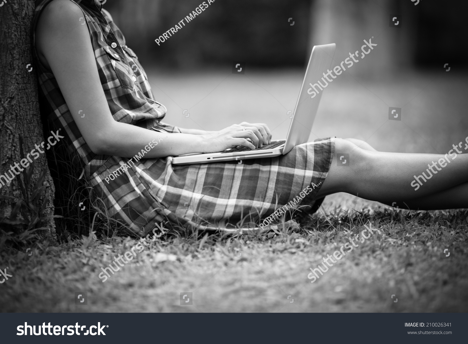 Young Caucasian woman using Laptop on nature