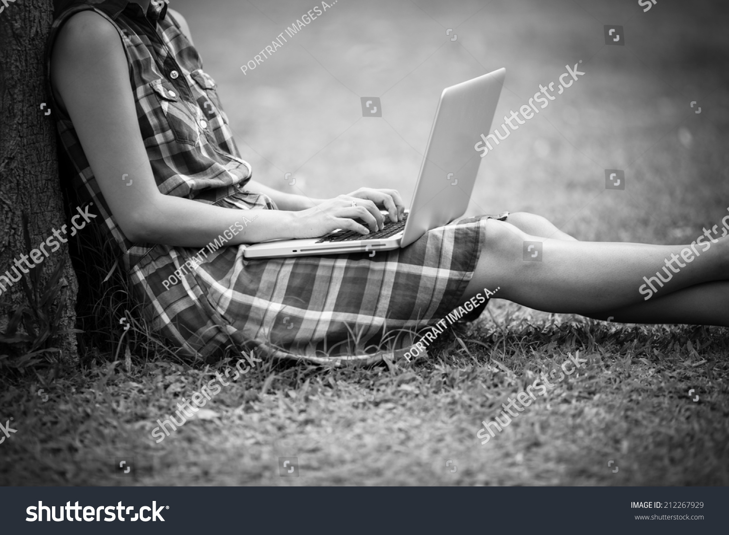 Young Caucasian woman using Laptop on nature