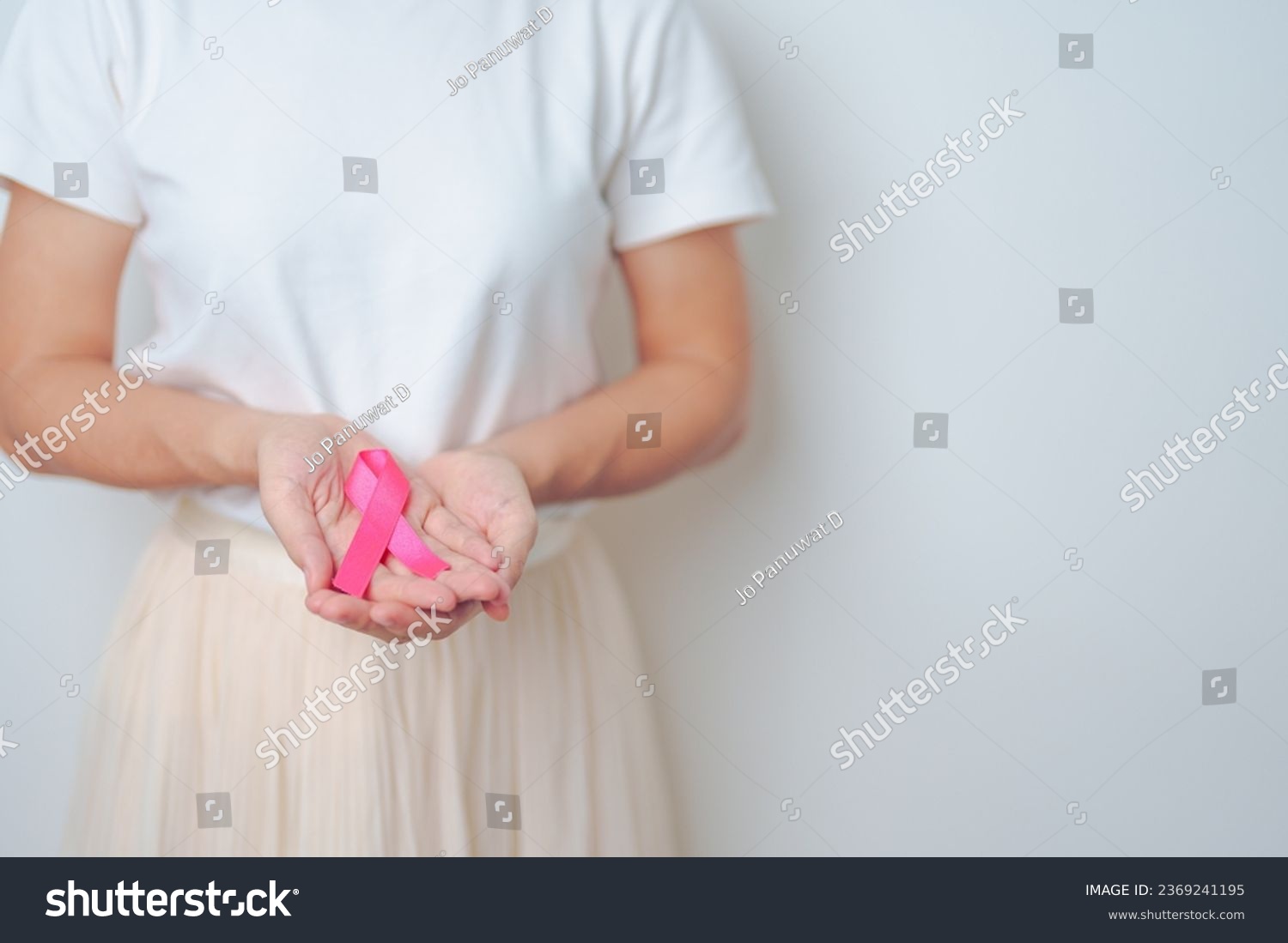 Pink October Breast Cancer Awareness month woman with pink Ribbon in hospital for support people life and illness. National cancer survivors month Mother and World cancer day concept