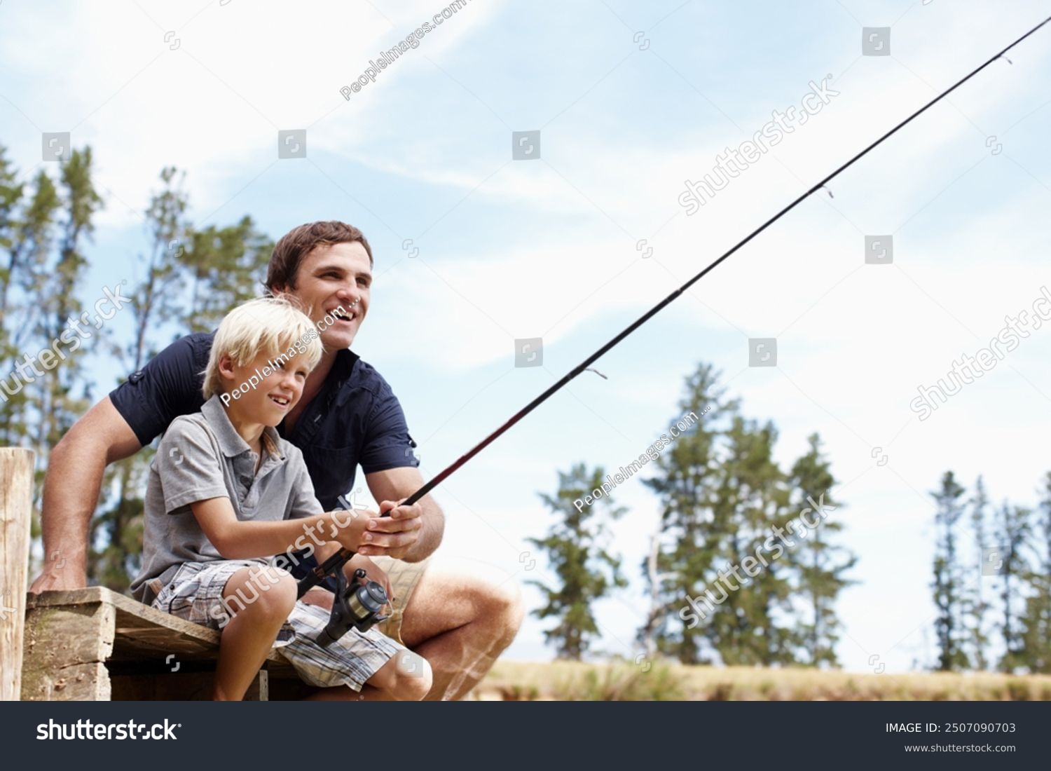 Father boy and fishing by lake for teaching vacation and travel together in summer with gear on dock. Dad son and catch fish in nature for learning holiday and development while bonding with line