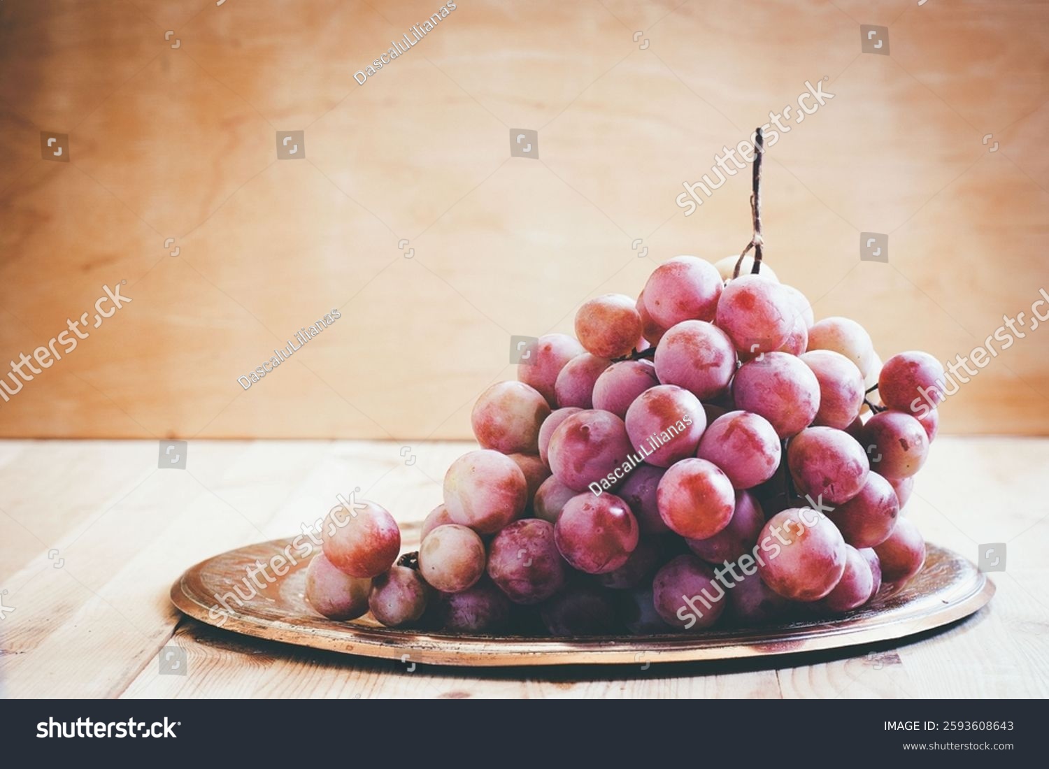 pink grapes on a metal tray