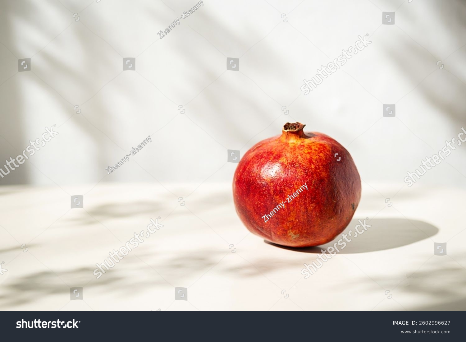 Single Pomegranate in Soft Natural Light with Interesting Shadows.