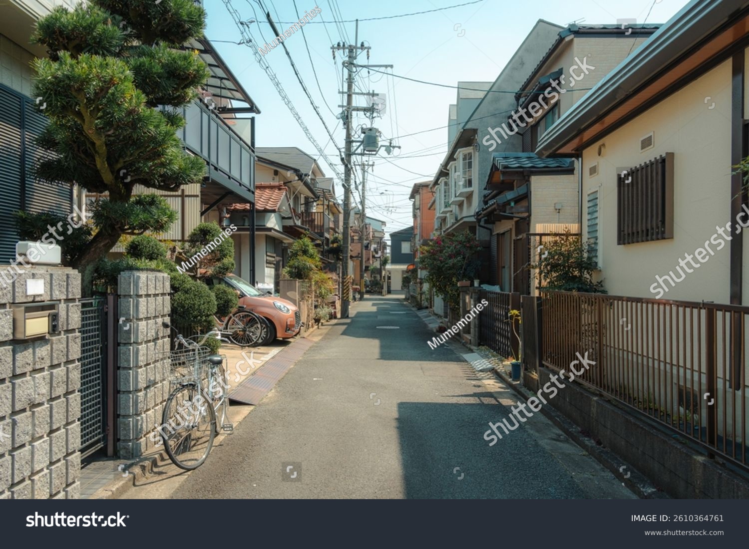 Quiet and cozy alley residential in japanese neighborhood with traditional houses  bicycle  car in suburban of Japan