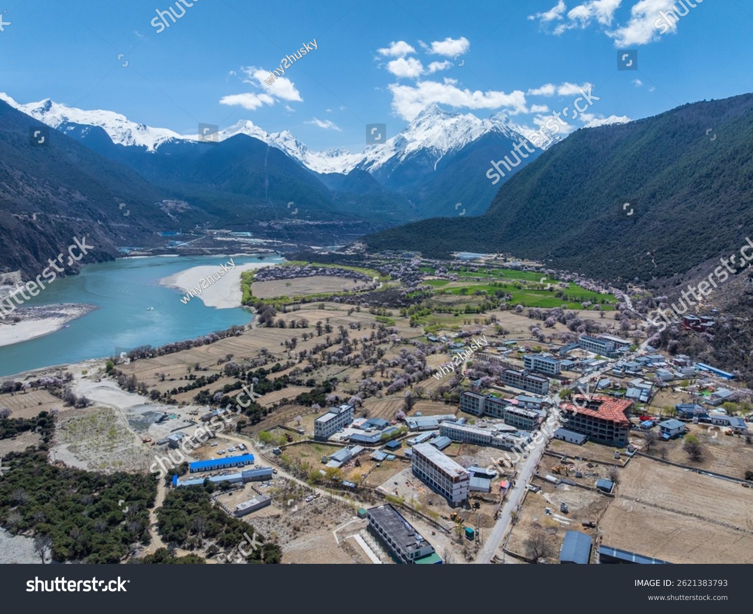 Nyingchi Tibet China - 7th April 2025 - aerial view of a normal village in Tibet China along snow mountains and yarlung zangbo river