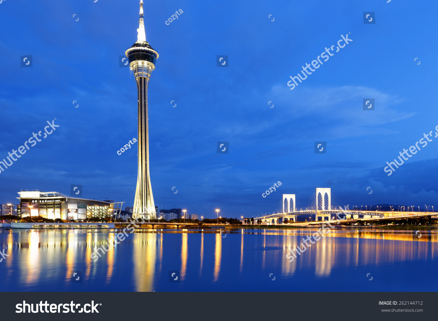 Urban landscape of Macau with famous traveling tower under sky near river in Macao  Asia.
