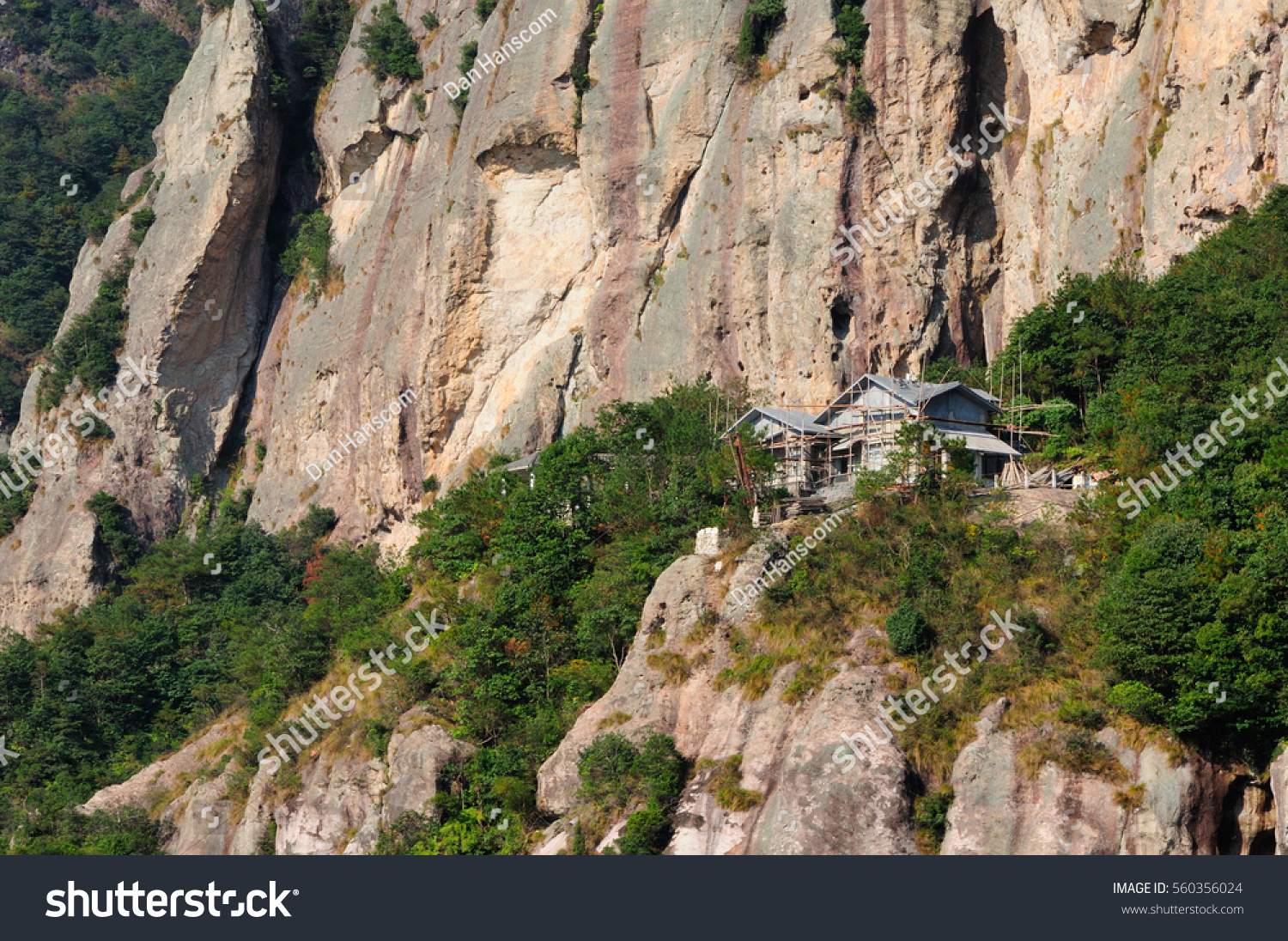 A building being built on the rocky cliffs in the Fangdong scenic area of Yandangshan located in Zhejiang province China.